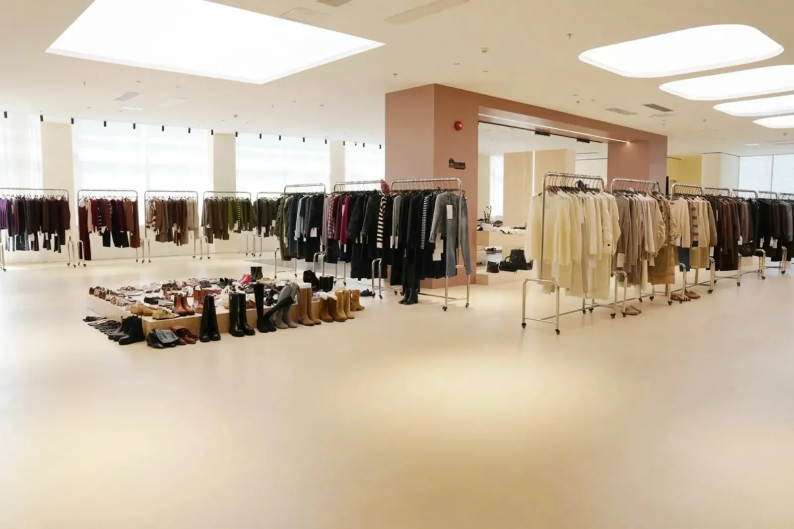 PIPK Guangzhou showroom with women's apparel samples on racks